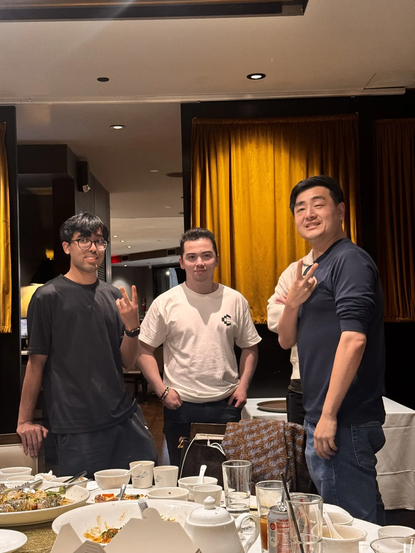 Three guests laughing at a founder dinner