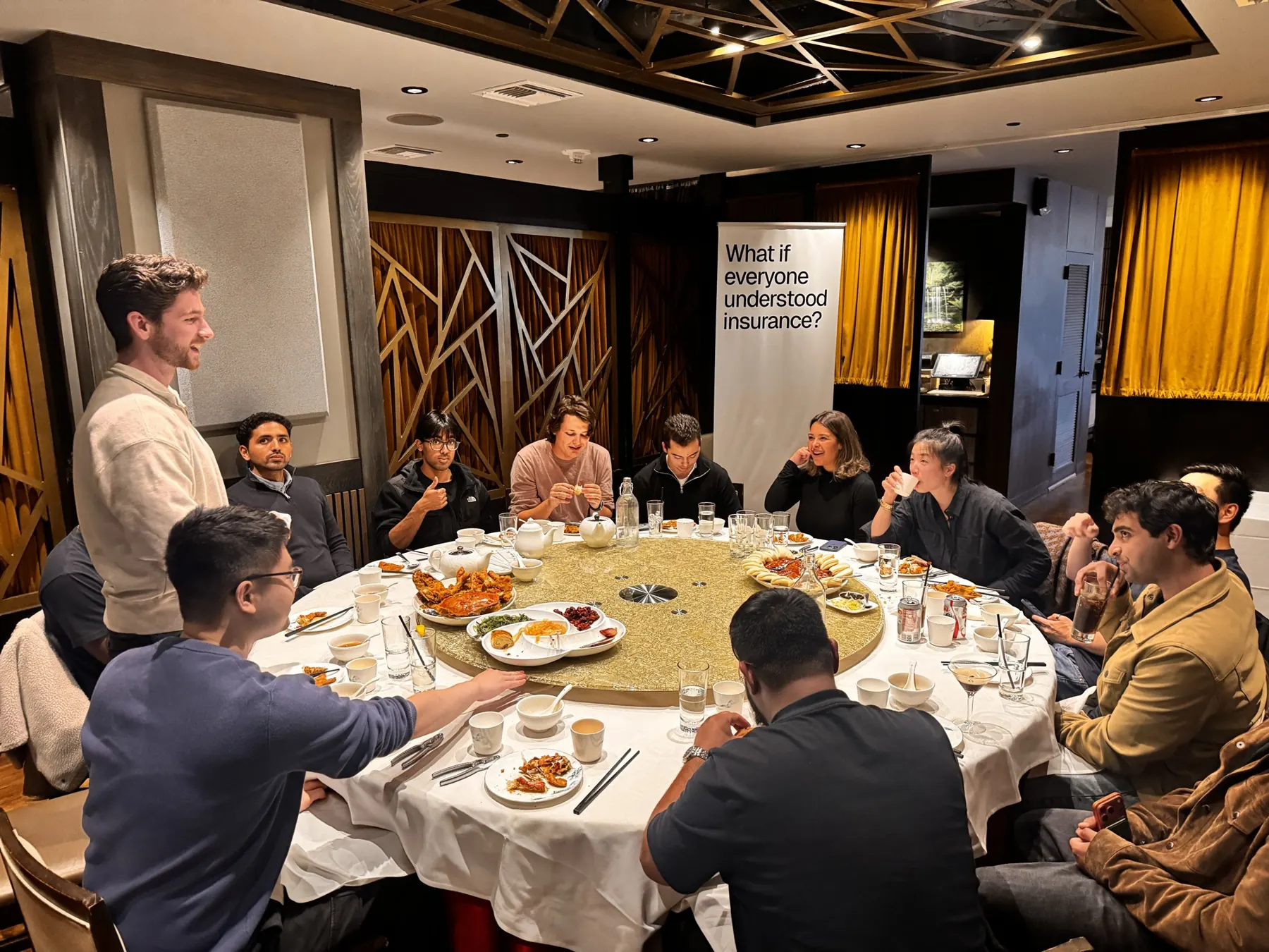 Guests around a round table at a founder dinner